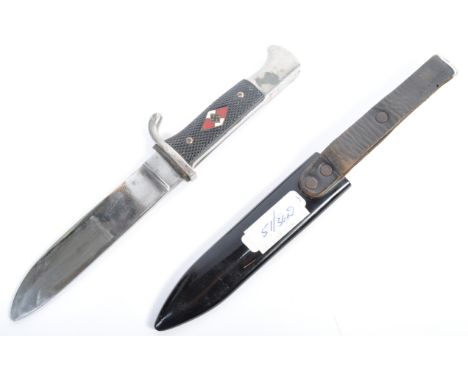 An original WWII Second World War German Nazi Third Reich HJ Hitler Youth dagger having black chequered grips with the Hitler