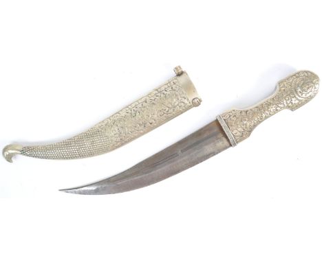 An antique 19th century Middle Eastern Jambiya dagger. Likely of Persian Gulf origins, the dagger is profusely decorated with