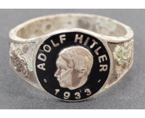 A WWII Second World War related Third Reich Nazi German NSDAP ring, the enamel facia depicting a bust of Adolf Hitler, with t