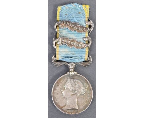 An original Crimean War British Army issue Crimea Medal with two clasps. Suspended on the original blue and white ribbon with