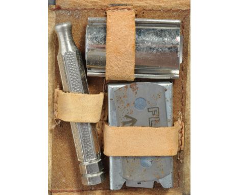 A rare WWII Second World War MI9 issued razor, with compass razor blade. The blade made by Fleet, with broad arrow for milita