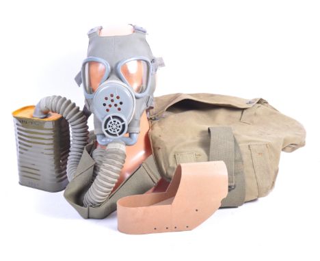 An original 1944 WWII Second World War US United States Army field protection gas mask / respirator. The mask of usual form r