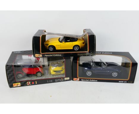 Maisto - 1/18 Scale. Three boxed 1/18 scale model cars appearing in Excellent condition with Fair boxes, some creasing on box