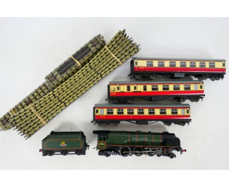 Hornby Dublo - A 3- rail 4-6-2 Duchess Of Montrose locomotive with 3 x red and cream coaches and track sections. The items sh