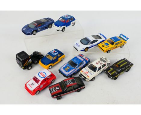 Scalextric - An unboxed group of 11 playworn Scalextric slot cars. Lot includes Ford Capri 3.0S; Audi Quattro Leyland T45 Roa