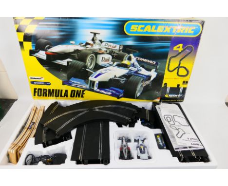 Scalextric - Formula One. A boxed #4 McLaren Williams F1 Team Scalextric. McLaren Mercedes MP4-16 / No. 4 V Williams F1 BMW F