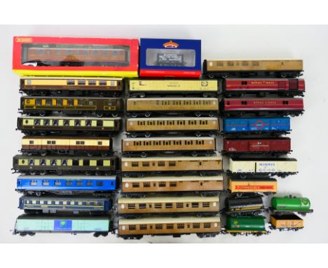 Hornby - Lima - Bachmann - A group of OO gauge rolling stock including Pullman coaches, LNER teak coaches, a boxed LNER Buffe