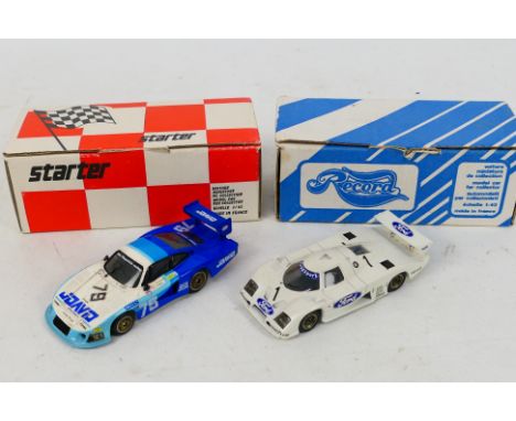 Starter - Record - 2 x boxed built kit models in 1:43 scale, a 1982 Monza Ford C100 and a Porsche 935. They appear in Very Go