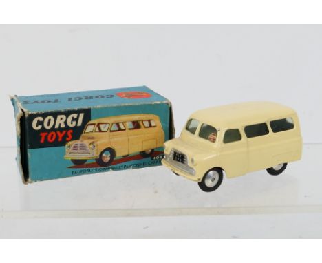 Corgi - A boxed Bedford CA Dormobile # 404. The model appears in Very Good condition with signs of light use. The box is Fair