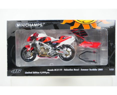 Minichamps - A boxed limited edition Valentino Rossi Honda RC211V 2001 Summer Test Bike in 1:12 scale # 122017946. The model 