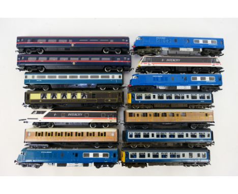 Hornby - Triang - An unboxed group of OO gauge locomotives, dummy cars and passenger coaches. Lot includes Hornby Class 110 D
