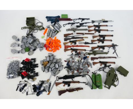 Palitoy - Hasbro - Action Man - Others - An unboxed arsenal of vintage Action Man weapons, and accessories which include belt