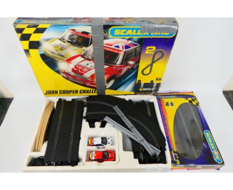 Scalextric - A boxed Scalextric 'John Cooper Challenge' set and a Scalextric C8307 Race + Lap Counter Pack. Set includes a qu