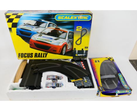 Scalextric - A boxed Scalextric 'Focus Rally' set and a Scalextric C8307 Race + Lap Counter Pack. Set includes a quantity of 