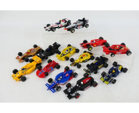 Scalextric - A grid of 14 unboxed playworn Scalextric Formula 1 / Formula 2 slot cars. Lot includes McLaren Mercedes Mp4; Lot