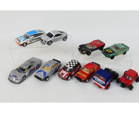 Scalextric - An unboxed group of 10 playworn Scalextric slot cars. Lot includes Leyland T45 Roadtrain (cab only); Datsun 260Z