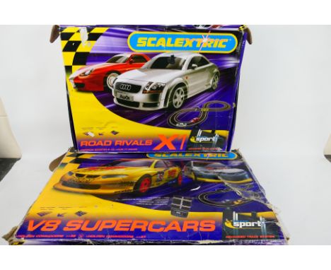 Scalextric - Two boxed Scalextric sets. Lot consists of a 'Road Rivals' set with Audi & Porsche cars; plus a 'V8 Supercars' s