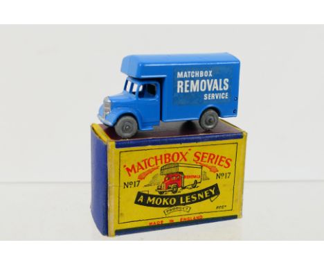 Matchbox - A boxed Bedford Removal van in blue # 17. It appears in Near Mint condition with some factory paint blemishes on t