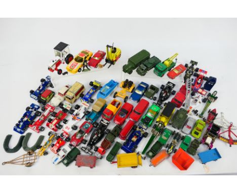 Dinky Toys - Corgi Toys - Matchbox - An unboxed collection of diecast model vehicles and some accessories in several scales. 