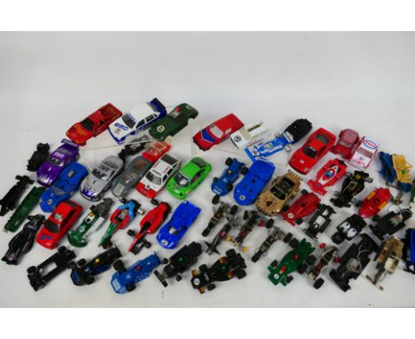 Scalextric - A collection of unboxed and playworn Scalextric slot car bodies, motors, chassis' and parts. Lot includes Aston 