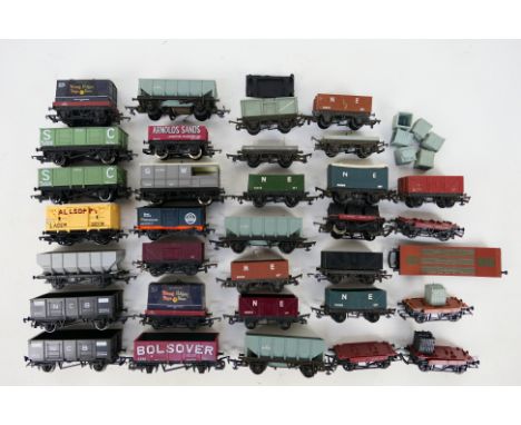 Hornby - Triang - An unboxed group of 33 items of OO/HO gauge freight rolling stock. Lot includes Triang 12T ore wagon 'Conse