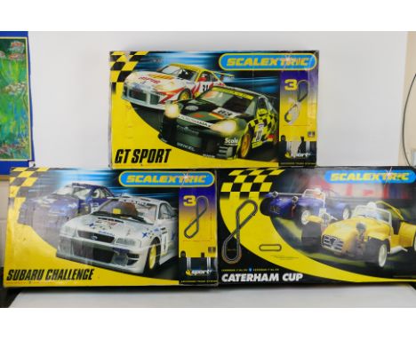 Scalextric - Three boxed Scalextric sets. Lot consists of a 'Subaru Challenge'; 'Caterham Cup' set and a 'GT Sport Set' - the