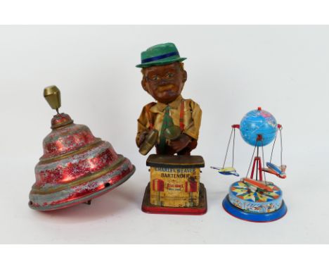 Rosko - DP - 3 x vintage tin toys, a spinning top marked D.P.ang made in West Germany, a Charley Weaver Bartender and a globe