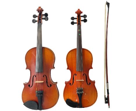 Two late 20th century cased Violins. Backs measuring (excluding button) 32.5cm and 31.5cm, with one bow. (2)