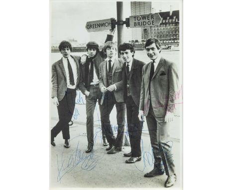 (Signed) Rolling Stones photograph. A charming early photograph of the band by the Thames under a Greenwich and Tower Bridge 