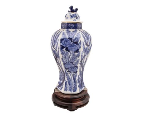 19th Century A blue and white lidded porcelain vase The body decorated with ferns and plum blossoms The lid decorated with sc