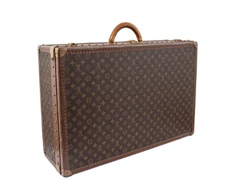 Property of a Gentleman  Louis Vuitton A large monogram canvas trunk With brass fittings, cream leather divider inserts, leat