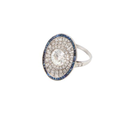 Art Deco A fine diamond and sapphire cluster ring The central old brilliant cut diamond mill grain set within a diamond and f