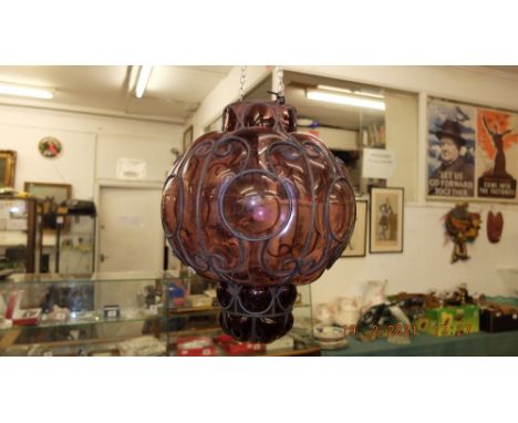 A glass and metal lamp