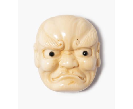Men-Netsuke Japan, 19. / 20.Jh. Elfenbein. Nô-Maske eines Beshimi. Mit Perlmuttplatte, aber unsigniert. L 3,5 cm. - Haariss.T
