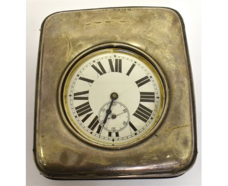 A LARGE POCKET WATCH/TRAVEL CLOCK the silver fronted travel case hallmarked for Birmingham 1915, fitted with a large metal ca