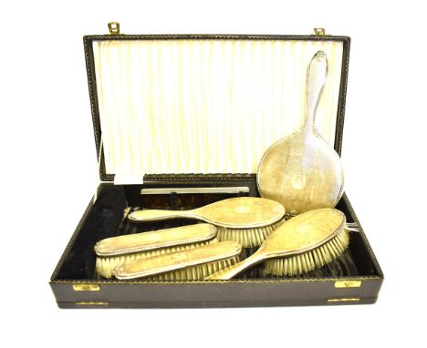 SILVER DRESSING TABLE SET Comprising hand held mirror, four brushes (hair and clothes) one comb in engine turned pattern with