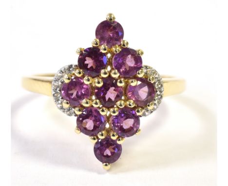 9CT GOLD NAVETTE PURPLE GARNET RING Navette measurement 2cm x 1.5cm. Ring size N3/4. Weight 2.6g approx.