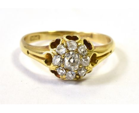 18CT GOLD OLD CUT DIAMOND DAISY RING The central diamond measuring approx 4mm in diameter. The daisy head measuring 9mm in di