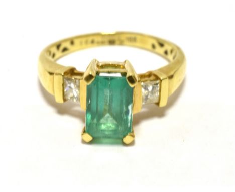 ILIANA 18k EMERALD AND DIAMOND COCKTAIL RING The step cut emerald measuring 9 x 6mm approx- diamond set shoulders, Ring size 