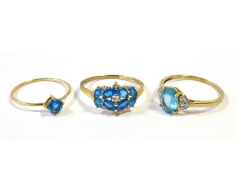 THREE GOLD BLUE PASTE SET DRESS RINGS RING SIZES R1/2, S, U. Total weight 5.3g Condition Report : Stones electric blue shades