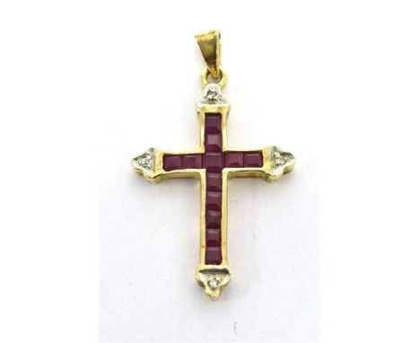 RUBY SET CROSS PENDANT  Calibre cut rubies set in yellow metal with millgrain white metal detail -  Bale stamped 375. Pendant