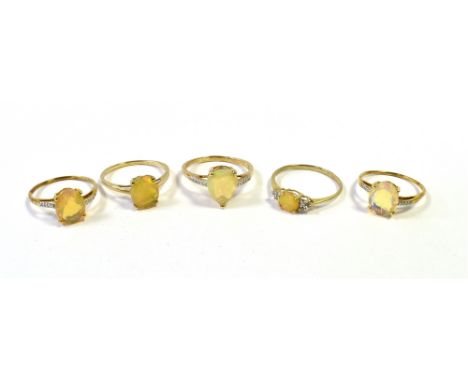 FIVE GOLD IMITATION OPAL DRESS RINGS One marked TGGC 10K. THREE MARKED 417 10K. ONE MARKED 375 Ring sizes P1/2, Q, R1/2, U , 