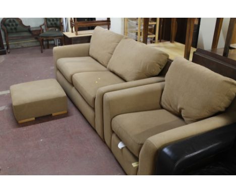 A MODERN UPHOLSTERED THREE PIECE SUITE, CONSISTING OF A SOFA, ARMCHAIR AND STOOL