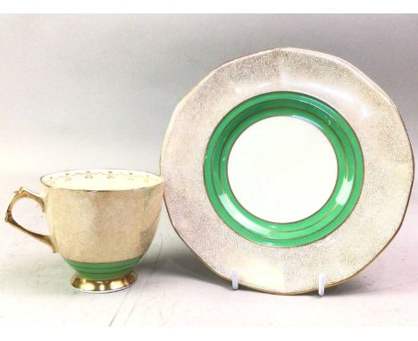 TUSCAN PART TEA SERVICE, green and gilt pattern, comprising cups, saucers, plates, cake plates, sugar and cream