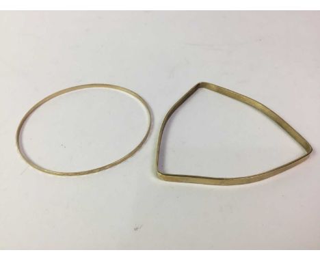 TWO BANGLES, one circular, marked for nine carat gold, one of triangular form, unmarked (2) Qty: the circular gold bangle 2.5