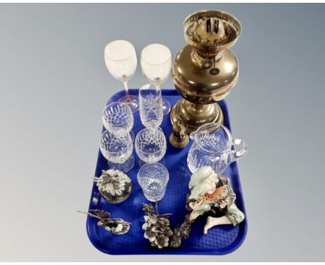 A tray of brass oil lamp base, Turkish brass nutmeg grinder, crystal wine glasses, pewter fairy figures etc 