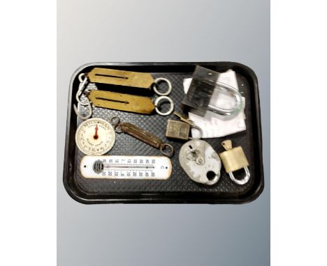 A tray of padlocks, enamelled thermometer, two pocket balances etc 