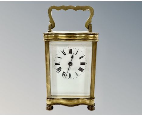 A French brass carriage clock, with unsigned movement and platform escapement, height 15cm including handle. 