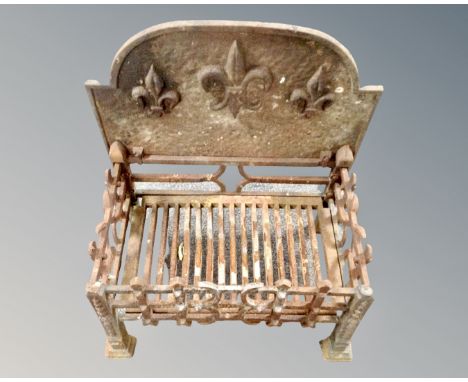 A nineteenth century cast iron fire grate 