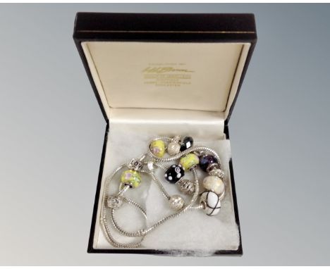 A silver charm necklace and similar bracelet, each stamped 925.